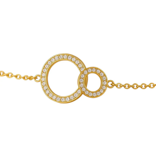 Bracelet doré Étreinte Eternelle– Duo d’anneaux & cristaux blancs Harmony & Senteur